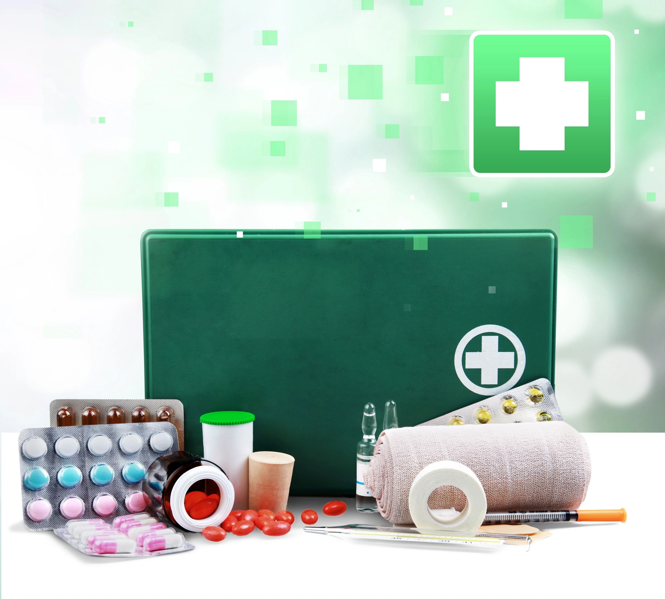 Medical consumables and first aid supplies arranged on a light background