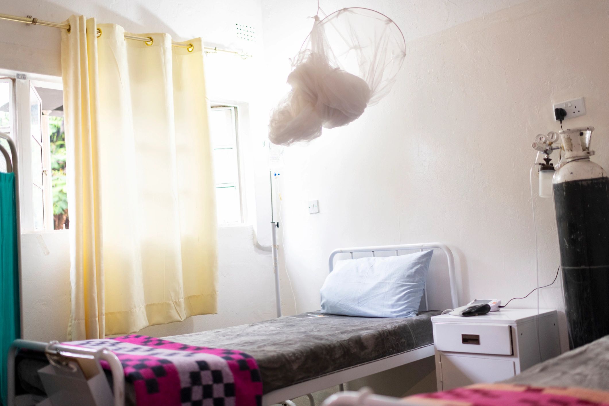 Hospital room with medical equipment representing healthcare supply needs